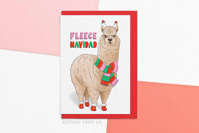 Funny Cute Christmas Card featuring an alpaca wearing a scarf and booties. Reading 'Fleece Navidad' perfect for sister, best friend, mum, grandma.