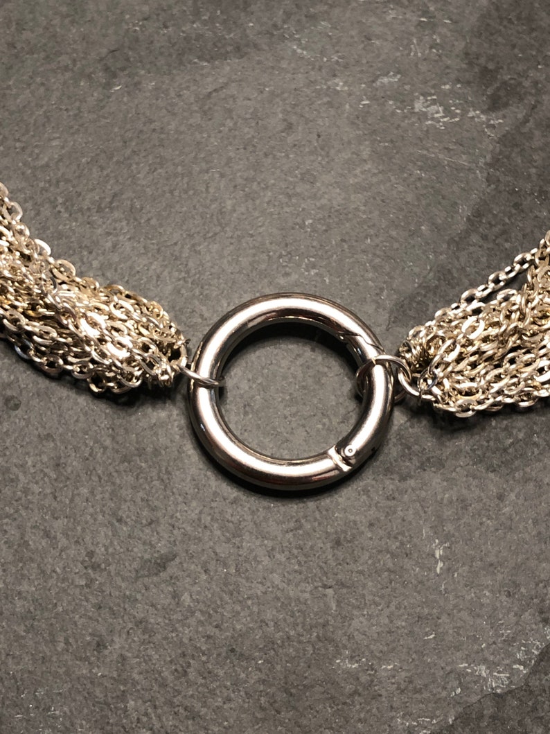 Elegant multi strand day collar with steel ring clasp.