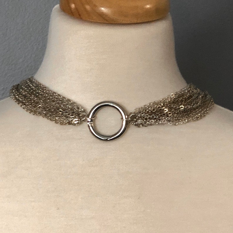 Elegant multi strand day collar with steel ring clasp.