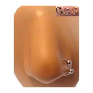 Aro nasal de doble bola, calibre 20, 18 y 16, de plata, dorado y negro, con orificio para la nariz de 8 mm de diámetro.