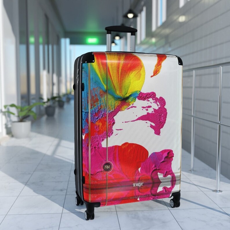 Abstract art hard shell suitcase featuring vibrant splashes of pink, red, yellow, orange, and blue on a glossy white background. Modern spinner luggage for creative travelers, perfect as a gift for artists and color lovers. Stylish carry-on suitcase with bold, unique painting-inspired design, ideal for holidays, business trips, and fashion-forward journeys. Durable, lightweight case blends contemporary aesthetics with bright pop art energy for men and women.