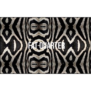 May include: A fabric with a zebra stripe pattern in black and white. The words "FAT-QUARTER" are printed in white across the center of the fabric. The fabric has a symmetrical design.