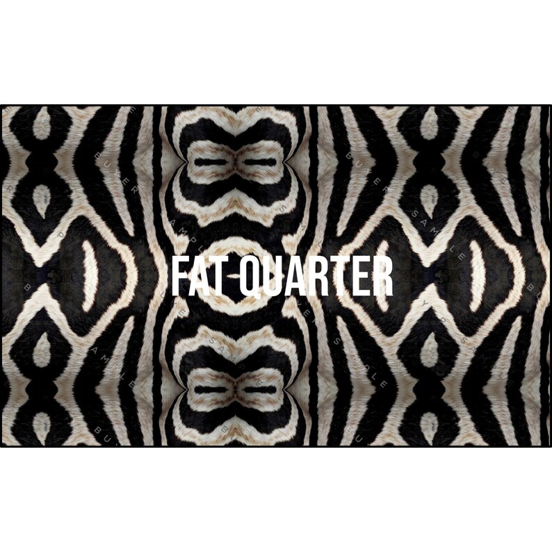 May include: A fabric with a zebra stripe pattern in black and white. The words "FAT-QUARTER" are printed in white across the center of the fabric. The fabric has a symmetrical design.