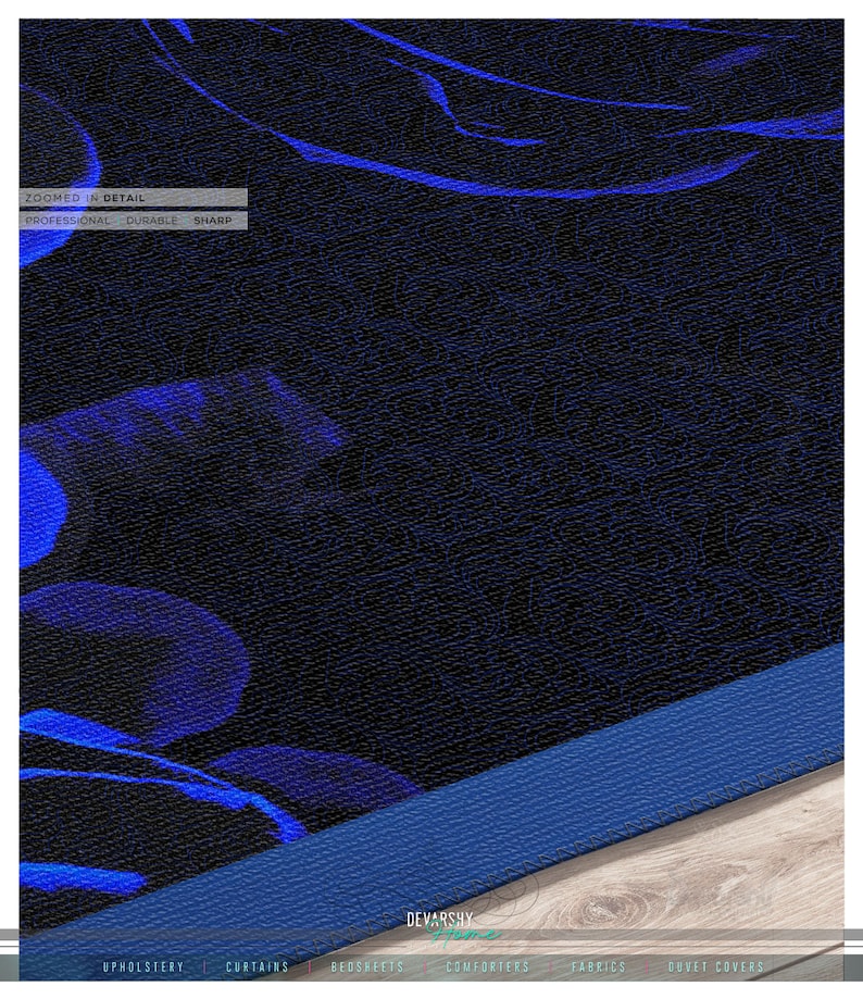 May include: A dark fabric featuring a vibrant blue floral pattern with a textured surface. The image includes text that reads ZOOMED IN DETAIL, PROFESSIONAL, DURABLE, SHARP, and DEVARSHY HOME, along with UPHOLSTERY, CURTAINS, BEDSHEETS, COMFORTERS, FABRICS, DUVET COVERS.