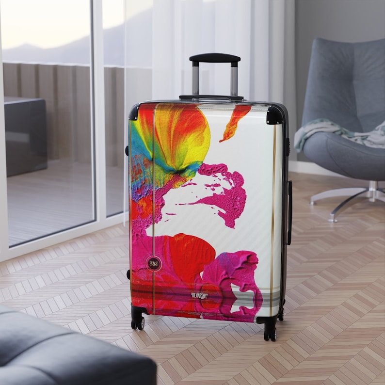 Abstract art hard shell suitcase featuring vibrant splashes of pink, red, yellow, orange, and blue on a glossy white background. Modern spinner luggage for creative travelers, perfect as a gift for artists and color lovers. Stylish carry-on suitcase with bold, unique painting-inspired design, ideal for holidays, business trips, and fashion-forward journeys. Durable, lightweight case blends contemporary aesthetics with bright pop art energy for men and women.