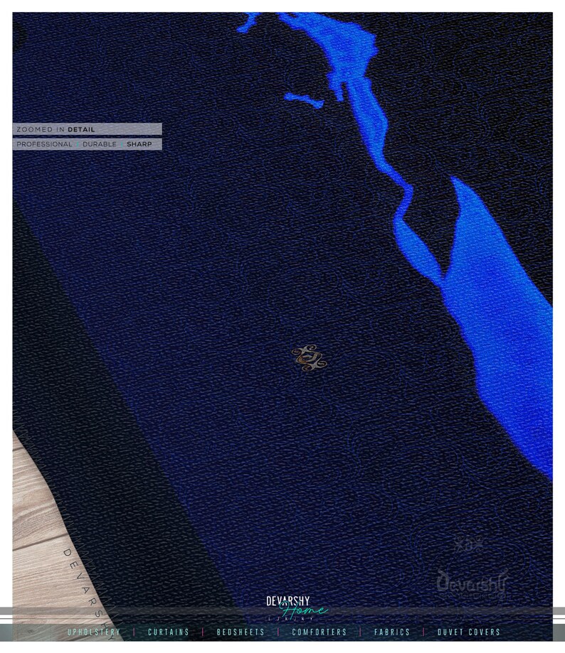 May include: A dark blue fabric with a textured surface and a bright blue abstract shape. The image includes the text: ZOOMED IN DETAIL, PROFESSIONAL, DURABLE, SHARP, DEVARSHY HOME LUXURY, UPHOLSTERY, CURTAINS, BEDSHEETS, COMFORTERS, FABRICS, DUVET COVERS.