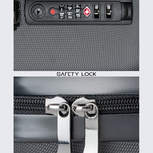 May include: Close-up of a black suitcase with a combination lock and a zipper. The lock has a red button and the numbers 1-4. The zipper is silver and has a black pull tab.