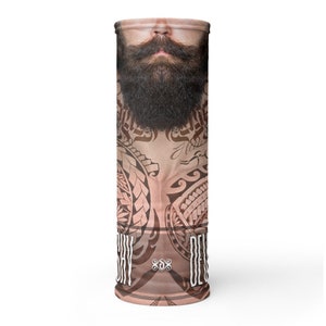May include: A brown and tan face mask with a tribal design and a bearded man's face. The text "SHY DEVIL" is printed on the mask.
