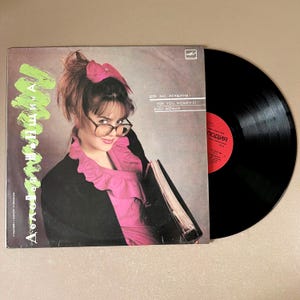 May include: A set of three ceramic mugs with a speckled, matte finish. The mugs are in shades of cream, light gray, and dark gray. Each mug has a simple, minimalist design, perfect for coffee or tea.