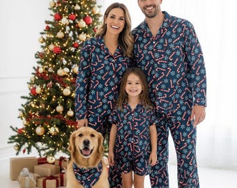 May include: Matching navy blue pajama sets featuring a repeating pattern of red and white candy canes and light blue snowflakes. The set includes long-sleeved button-down shirts, long pants, shorts, and a matching triangular pet bandana.