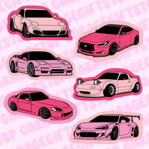 May include: A collection of six pink car stickers featuring various sports car models. Each sticker has a white outline and is set against a light pink background with repeating text. The cars are in shades of pink and have black wheels.