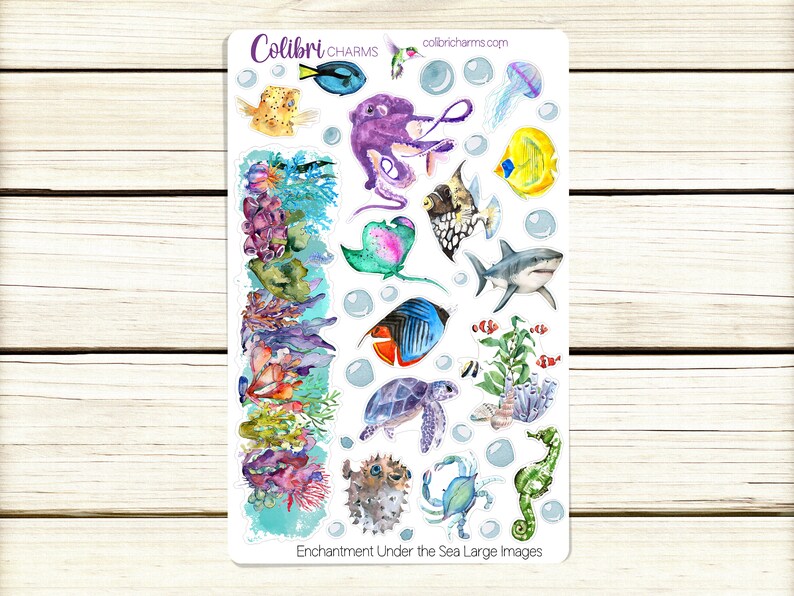 May include: A sheet of colorful stickers featuring underwater sea life, including a purple octopus, a blue and orange fish, a seahorse, a starfish, a shark, and coral. The stickers are labeled "Enchantment Under the Sea Large Images".