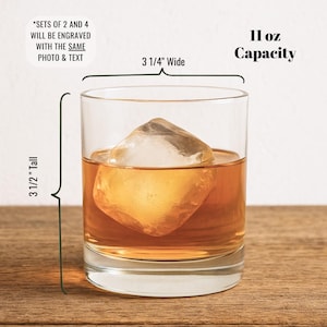 This picture shows an 11 ounce premium whiskey glass that is 3 1/2 inches tall and 3 1/4 inches wide that is permanently etched with a logo or photograph.  This custom engraved bourbon cocktail glassware is the perfect gift idea for groomsmen, anniversaries, birthdays, retirements, and other milestone occasions worth celebrating.
