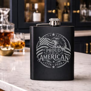 Engraved Hip Flask Portable Drinking Stainless Steel Construction Eight Ounce Capacity Leak Proof Design Patriotic Theme America Anniversary Edition Personalized Gift Option Eagle Motif American Flag Imagery Freedom Celebration Accessory Perfect Veteran