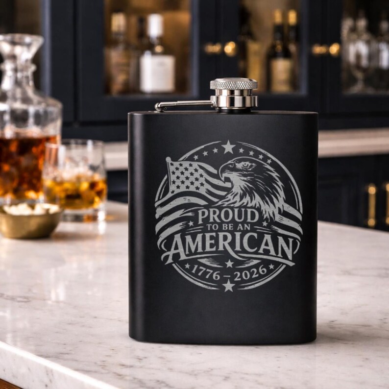 Engraved Hip Flask Portable Drinking Stainless Steel Construction Eight Ounce Capacity Leak Proof Design Patriotic Theme America Anniversary Edition Personalized Gift Option Eagle Motif American Flag Imagery Freedom Celebration Accessory Perfect Veteran