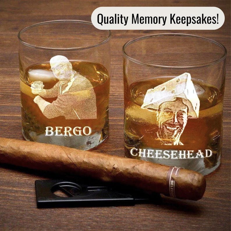 This picture shows a group of photo engraved whiskey bourbon glasses resting on a wooden bar top.  Each glass is engraved with a picture of a groomsman with his name engraved under the photograph.  Next to the etched picture glassware set is a cigar and cigar cutter.  This bar cup set with picture makes a unique quality memory keepsake!