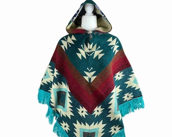 May include: A turquoise, red, and cream hooded poncho with a geometric pattern and fringe trim.