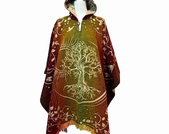 May include: A hooded poncho with a tree of life design in shades of green, yellow, and orange. The poncho has a red background with a fringe border.