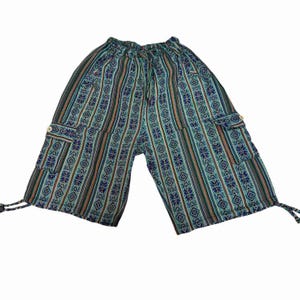 May include: Knee-length shorts featuring a vertical striped pattern in shades of teal, blue, orange, and black. The shorts have an elastic waistband with a drawstring, two side cargo pockets with button closures, and adjustable drawstrings at the hems.