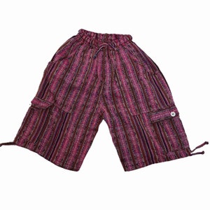 May include: Pink and black striped cotton shorts with a drawstring waist and two large cargo pockets.