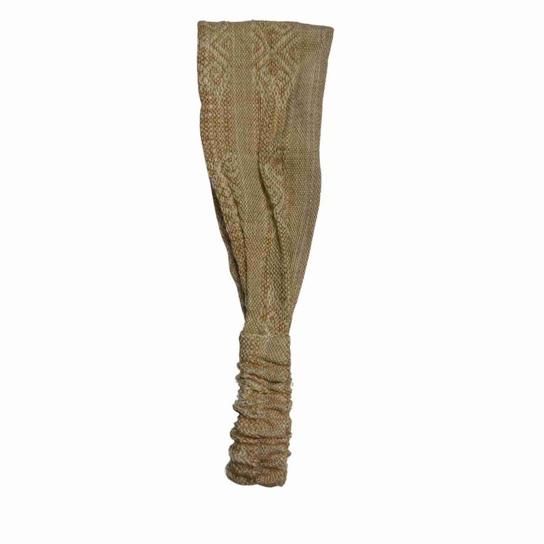 May include: A brown and beige knitted headband with a geometric pattern.