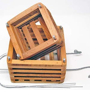 May include: A rustic wooden sign with the text "Welcome to our home" in white lettering. The sign features a distressed finish and a simple, inviting design, perfect for front door decor.