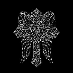 May include: A rhinestone transfer design featuring a central cross with an intricate floral pattern at the intersection, flanked by two large, detailed angel wings. The entire motif is composed of small, white, reflective circular studs.