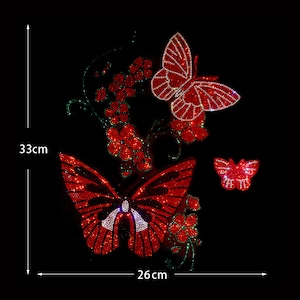 May include: Red rhinestone butterfly applique with a floral design. The applique measures 26 cm wide and 33 cm tall.