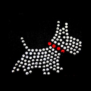 May include: A black background with a white dog silhouette made of rhinestones. The dog has a red rhinestone collar.