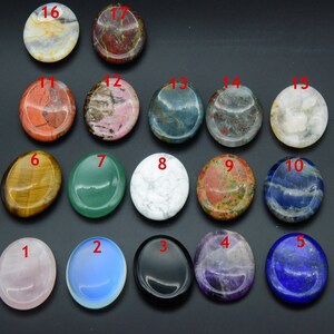 May include: Assortment of 17 polished, round, flat stones in various colors and patterns. The stones are numbered 1 through 17.