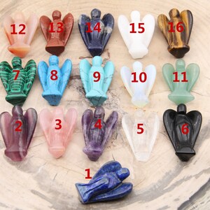 May include: A set of 16 angel figurines carved from various gemstones, including amethyst, rose quartz, and lapis lazuli. Each figurine is numbered 1 through 16.