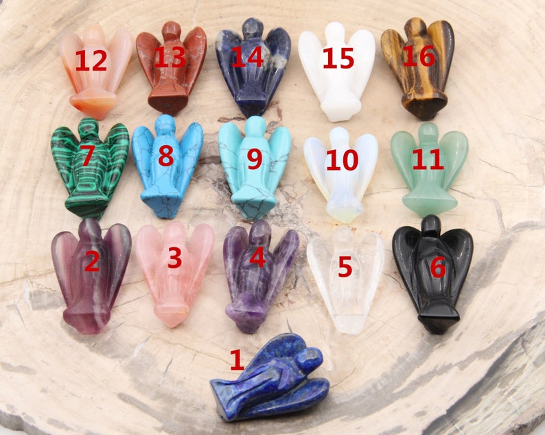 May include: A set of 16 angel figurines carved from various gemstones, including amethyst, rose quartz, and lapis lazuli. Each figurine is numbered 1 through 16.