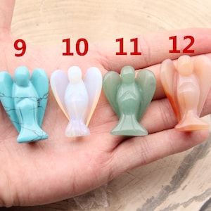 May include: Four small angel figurines carved from different types of stone. The angels are in a row from left to right: turquoise, white, green, and peach. The numbers 9, 10, 11, and 12 are written above each angel.