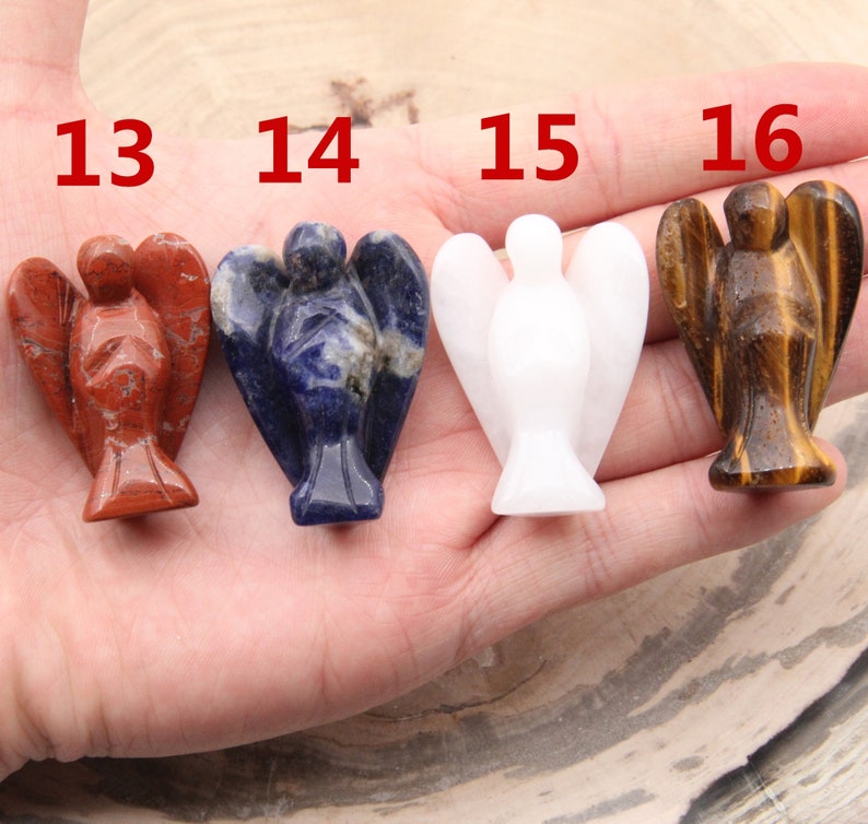 May include: Four angel figurines carved from different types of stone. The angels are red, blue, white, and brown. The numbers 13, 14, 15, and 16 are visible above the angels.