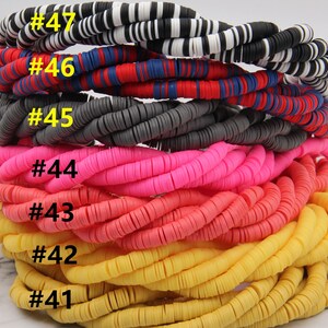 May include: A stack of colorful round polymer clay beads in various colors, including black and white, red, blue, gray, pink, orange, and yellow. The beads are numbered #41 through #47.