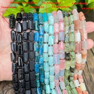 May include: A hand displays strands of colorful gemstone beads. The beads include black tourmaline, raw tourmaline, apatite, amazonite, morganite, prehnite, and mix moonstone. Each bead is a rectangular shape and strung together.