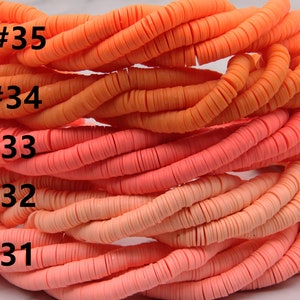 May include: Five strands of orange, pink, and peach colored polymer clay beads. The beads are stacked on top of each other and are all the same size and shape. The beads are labeled with numbers 31 through 35.