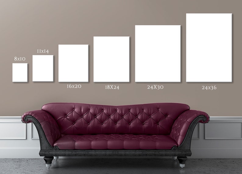 May include: Five different sizes of blank white canvas prints displayed on a wall above a burgundy tufted sofa. The canvas sizes are 8x10 inches, 11x14 inches, 16x20 inches, 18x24 inches, 24x30 inches, and 24x36 inches.