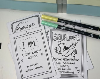 Könnte beinhalten: Weiße Karten mit schwarzen Strichzeichnungen und Text, darunter "Mindfulness", "I AM... A SELF ESTEEM ACTIVITY" und "SELF LOVE". Zwei gelbe und mintgrüne Dual-Tip-Marker sind ebenfalls zu sehen.