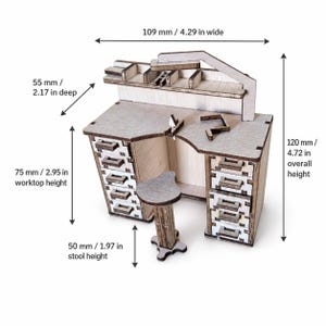 May include: A miniature wooden jeweler's workbench with a matching stool, featuring multiple drawers and a shelf. The workbench is 4.29 inches wide, 2.17 inches deep, and 4.72 inches high, with a 2.95-inch worktop height and a 1.97-inch stool height.