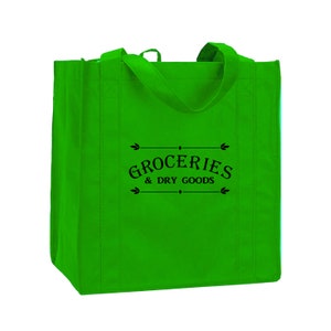 May include: A bright green reusable shopping tote bag with black handles and the text "GROCERIES & DRY GOODS" printed on the front.