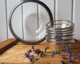 Fine, old salad dishes with silver-plated rim, glass bowls set