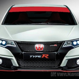 May include: A white Honda Civic Type R with a red racing stripe across the windshield. The car has a black front bumper with a black grille and a red Honda emblem. The car has a red "Type R" badge on the front bumper.