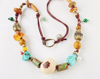 Tagua seed, trade beads, turquoise, amber, wood, malachite, açaí seeds, rose & green quartz, amethyst, lapis lazuli, leather cord necklace