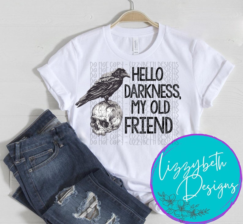 May include: White t-shirt with a black and white illustration of a raven perched on a skull. The text "Hello Darkness, My Old Friend" is printed on the shirt.