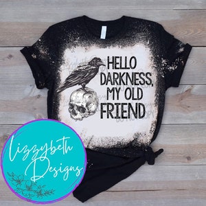 May include: Black t-shirt with a bleached design featuring a raven perched on a skull with the text "Hello Darkness, My Old Friend".