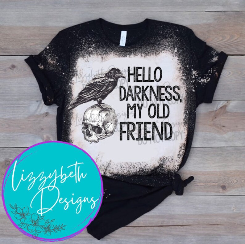 May include: Black t-shirt with a bleached design featuring a raven perched on a skull with the text "Hello Darkness, My Old Friend".