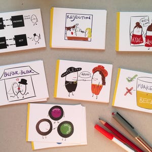 May include: A set of 10 illustrated cards with yellow borders. The cards feature various illustrations and text, including "Rejection", "Balfour Balfour", "Camplieish", "Hyde Wrench", and "Foakes Beer".