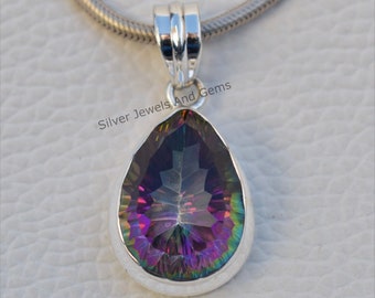May include: A pear-shaped iridescent gemstone pendant with a silver setting. The pendant is attached to a silver chain.