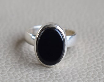 silver ring with black stone